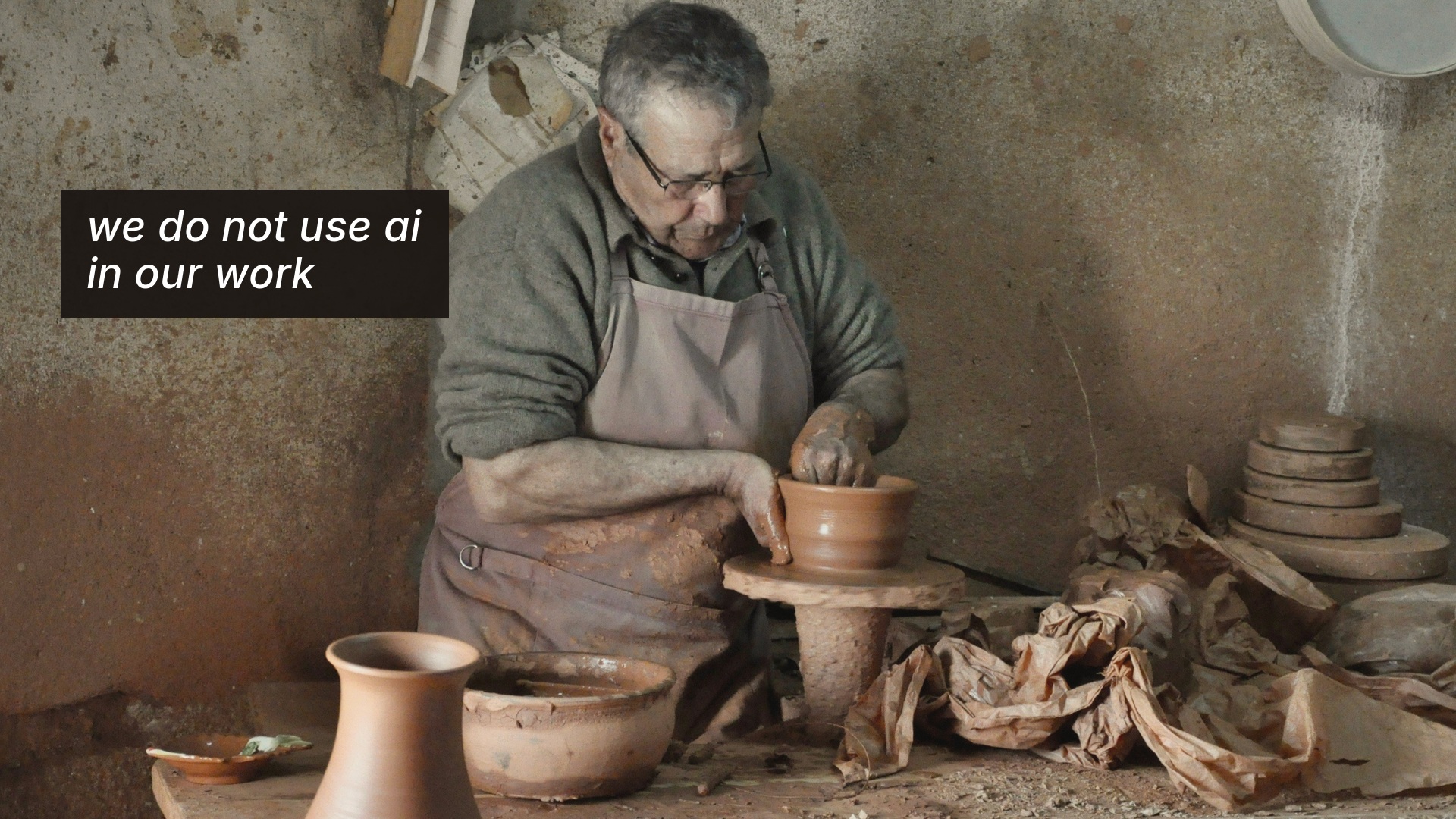 Potter shaping clay — we do not use ai in our work (level 0)